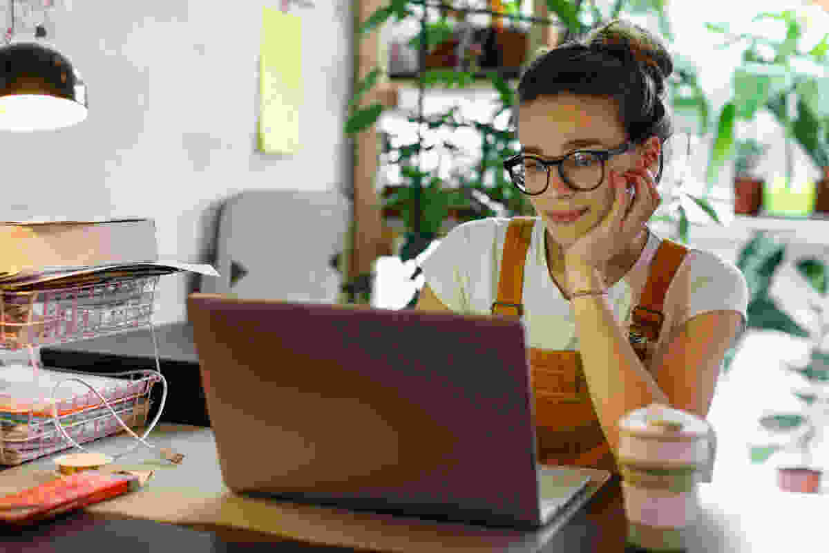 A woman working from home with her computer